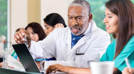 Doctor working with a medical student.